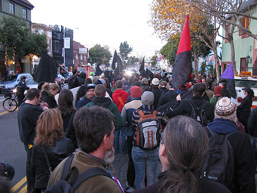 Demonstrators in solidarity with the Greek Uprising pause at New College on Valencia Street in San Francisco, Dec. 20, 2008.